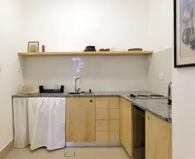a kitchen with a sink and a counter top at Sunny Studio in Amman in Amman