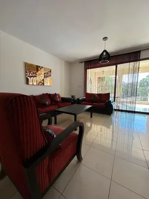 a living room with a couch and a table at Two Bed rooms apartment in Talabay Aqaba Jordan in Aqaba