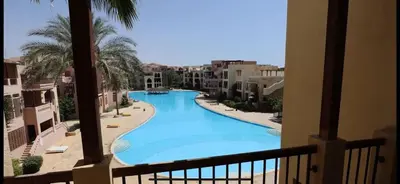 a view of a swimming pool from a balcony at Two Bed rooms apartment in Talabay Aqaba Jordan in Aqaba