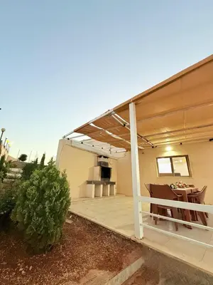 a porch of a house with a roof at Milano villa & farm in Balīlā