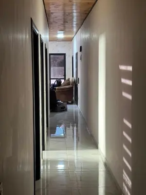 a hallway with a couch in a living room at New Rooftop 3 bedroom furnished apartment- Super deluxe in Amman