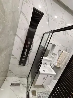 a bathroom with a sink and a mirror at Luxury comfortable apartment