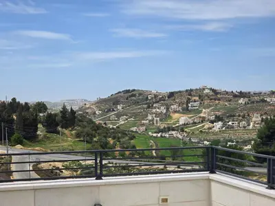 a balcony with a view of a mountain at Villa rooftop with stunning view apartment in Amman