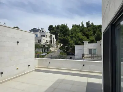 an open balcony with a view of a building at Villa rooftop with stunning view apartment in Amman