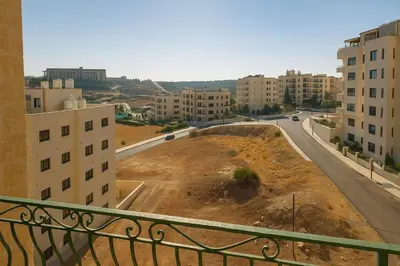 a view of a city from a balcony at The Central Family Apartment in Amman