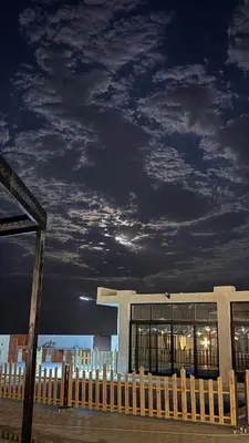 a building with a fence in front of it at olive tree farm and chalet - مزرعه و شاليه شجره الزيتون