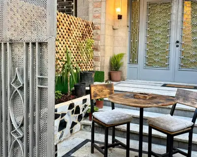 a table and two chairs on a patio at Spacious central apartment in Amman