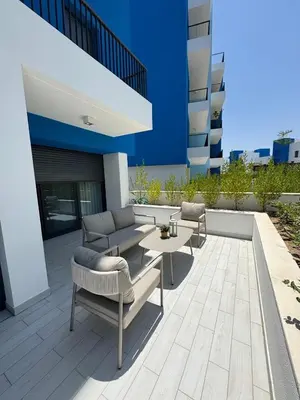 a patio with couches and a table on a building at Ayla-Azure in Aqaba