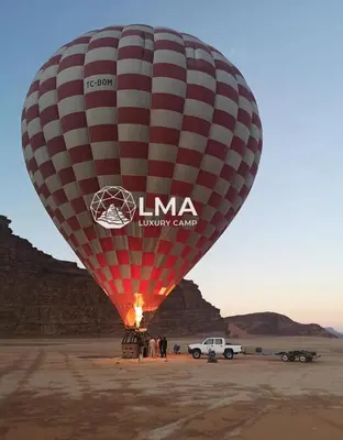 a large hot air balloon in the desert at LMA Rum Luxury Camp in Wadi Rum