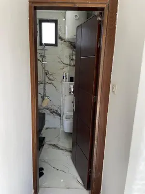 a bathroom with a toilet in a room at For Rent ,New Furnished Rooftop in Shafa Badran in Amman