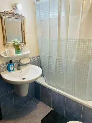 a bathroom with a sink and a shower at Luxurious furnished apartment for rent with hotel finishes in Amman