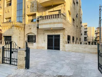 a building with a gate in front of it at Luxurious furnished apartment for rent with hotel finishes in Amman