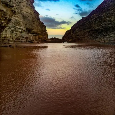 a view of a body of water between two mountains at Moon House & Sunset Tour in El Quweira