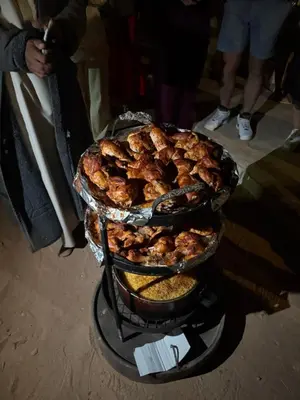 a pile of food sitting on top of a grill at Nala Luxury Camp & Bubbles Hotel in Wadi Rum