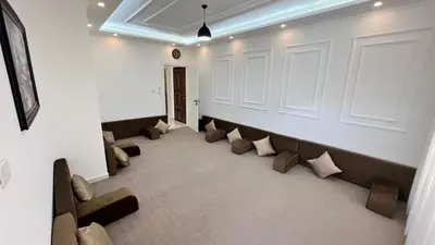 a waiting room with couches and pillows on the wall at شقة مفروشة ثلاث غرف الجاردنز in Amman