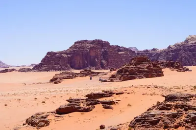 a view of the desert with rocks and mountains at Dune Camp Tours in Wadi Rum