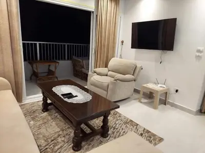 a living room with a chair and a coffee table at Yousef chalet in Amman