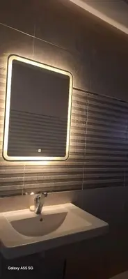 a bathroom with a sink and a window at Samara inn in Aqaba