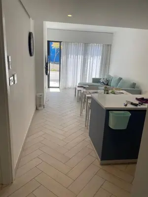 a kitchen and dining room with a table and chairs at العقبة in Aqaba