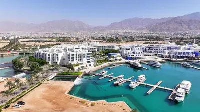 an aerial view of a marina with boats in the water at One bedroom at ayla azure in Aqaba