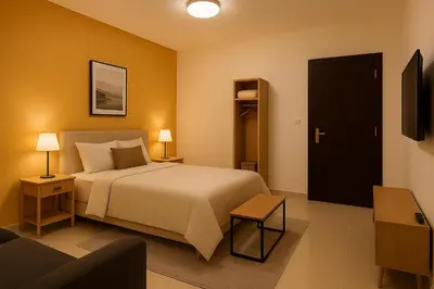 a hotel room with a bed and a couch at Stay with Obada Private Room in Amman