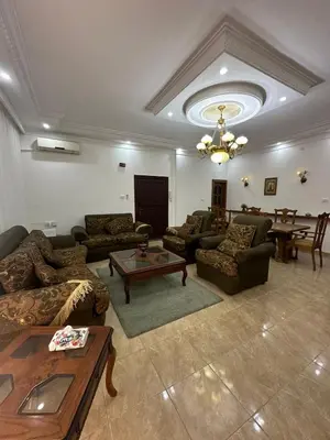 a large living room with couches and a table at 3 Bedroom Family Apartment in Amman in Amman