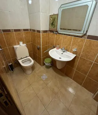 a bathroom with a toilet and a sink at 3 Bedroom Family Apartment in Amman in Amman