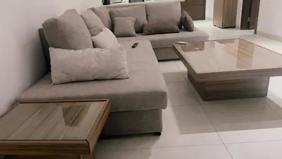 a couch and a coffee table in a living room at شقه بغرفة نوم في قريه الراحة one bedroom apartment in alraha village in Al Jafr
