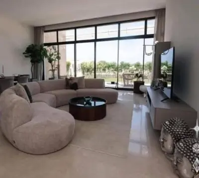 a large living room with a couch and a table at Jordan farm in Amman