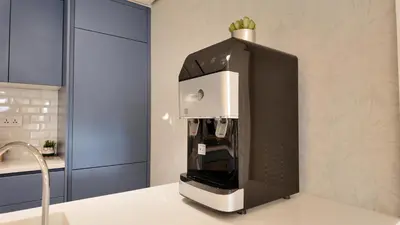a coffeemaker sitting on a counter in a kitchen at شقه للإيجار في ايله للعائلات in Aqaba