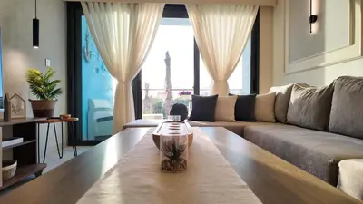 a living room with a couch and a table at شقه للإيجار في ايله للعائلات in Aqaba