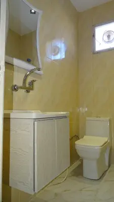 a bathroom with a toilet and a sink at Petra Luminous Apartment in Wadi Musa