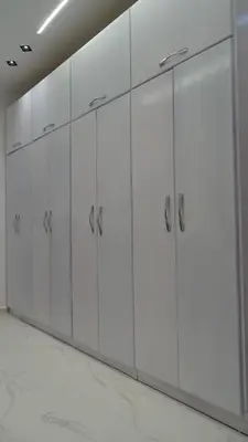 a row of white lockers in a room at Petra Luminous Apartment in Wadi Musa