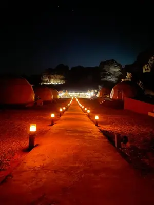 a row of candles on a road at night at Starlight Camp in Disah
