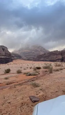 a view of a desert with a mountain in the background at The Celestial Dome in Disah