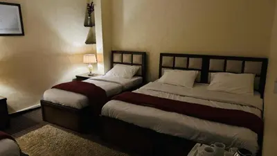 a hotel room with two beds in a room at Petra center suite in Wadi Musa