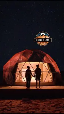 two people are standing in front of a tent at ROYAL SAVOY lUXURY CAMP in Wadi Rum