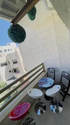 a room with three chairs and two tables and a bench at شقة مفروشة في طبربور in Amman