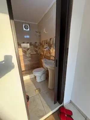 a bathroom with a toilet and a sink at petra towering rock in Wadi Musa