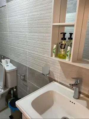 a bathroom with a sink and a toilet at Noor Luxury Camp Wadi Rum in Wadi Rum