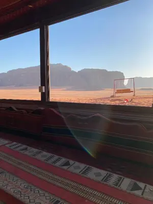 a window with a view of a soccer goal at Rum Tale Camp in Wadi Rum