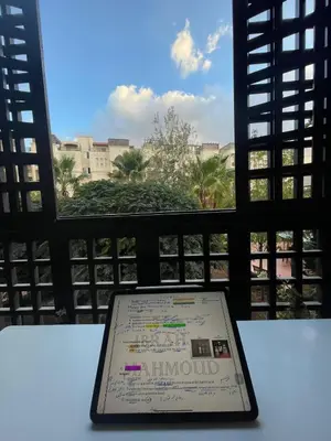 a tablet computer sitting on a table in front of a window at Al qaoud apartment in Aydūn