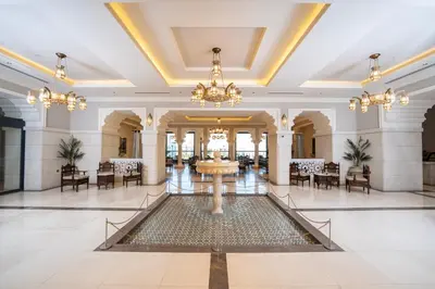 a large lobby with a fountain in the middle at كمباوند شقة مفروشة كومباوند الامعري المطار in Amman
