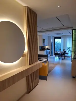 a living room with a large mirror on the wall at كمباوند شقة مفروشة كومباوند الامعري المطار 222 in Amman