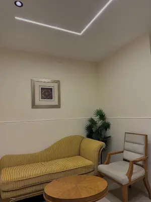 a living room with a couch and a chair at The cava in Amman