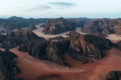 an aerial view of a mountain range at faisal wadi rum in Wadi Rum