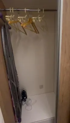 a room with a shelf with some items on the wall at السلام الشقق الفندقية peace hotel apartments in Aqaba