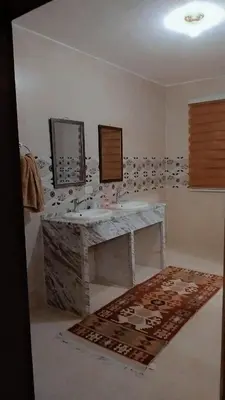 a bathroom with a sink and a mirror at Peace House in Wadi Musa
