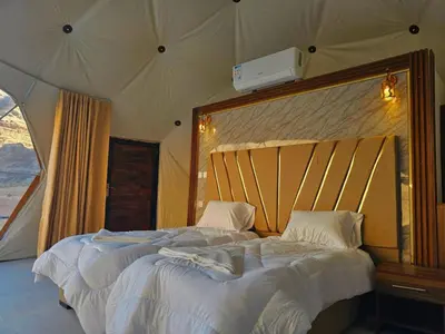 a bedroom with a large bed in a tent at Lunar scape haven in Wadi Rum