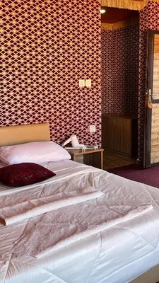 a bedroom with a large white bed in a room at Wadi Rum Sila Camp in Wadi Rum